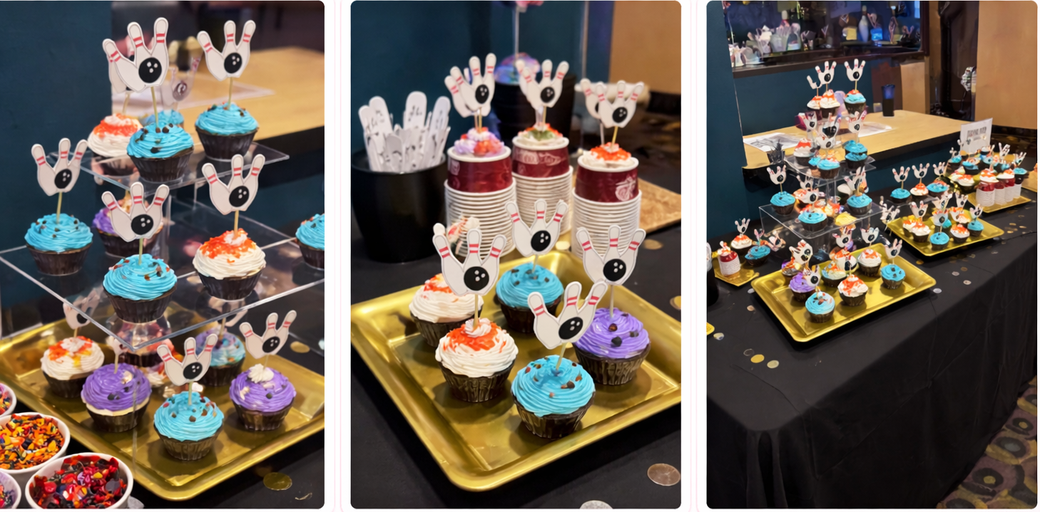 A colorful display of cupcakes decorated with bowling-themed toppers, featuring various frosting colors and toppings, arranged on tiered stands and plates at a festive event.